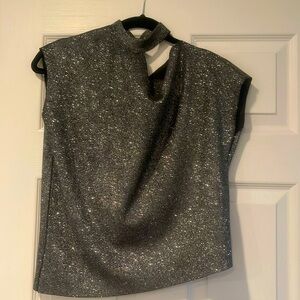 Asymmetrical top. Silvery shimmer .Fun ,with jeans or dressy for a night out